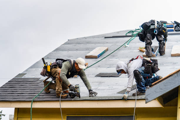 Professional Storm Damage Roof Repair technician working in Hudson, MA